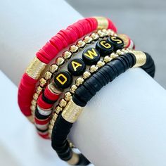 University Of Georgia Bulldogs Stackable Stretchy Bracelet Stack. Bracelets Are Custom Made With To Size, To Order. They Are Hypoallergenic And Made Of: Heishi Clay Beads, 18k Gold Filled Spacer Beads, & Gold Plated Disc Beads. Instructions: 1. Measure Your Wrist (See Photo) And Select Size From Drop Down Menu. * Please Double Check Your Wrist Size And Double Check The Size You Ordered. Care: Keep Bracelets Dry And Away From Chemicals. Roll Bracelet On Instead Of Stretching Over Hand. Bracelets Georgia Bulldog Bracelet, Hand Bracelets, Keep Bracelet, Stack Bracelets, University Of Georgia, Stretchy Bracelets, Georgia Bulldogs, Clay Beads, Bracelet Stack