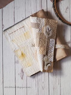 a close up of a piece of cloth on top of a wooden table with scissors