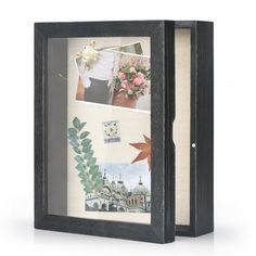 a wooden frame with pictures and flowers in it on a white background, there is an image of a building