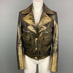 Maison Martin Margiela Jacket Comes In A Olive & Gold Leather With A Full Liner Featuring A Notch Lapel Style, Large Zipper & Flap Pockets, And A Buttoned Closure. Made In Italy.Excellent Pre-Owned Condition. Marked: 40 Measurements: Shoulder: 16 Inches Bust: 36 Inches Sleeve: 25 Inches Length: 21.5 Inches Sui Generis Reference: 108892 Category: Jacket (Outdoor) More Details Brand: Maison Martin Margiela Gender: Female Size: 4 Color: Olive Color 2: Gold Fabric: Leather Pattern: Solid Style: Coll Designer Gold Single Breasted Outerwear, Designer Gold Single-breasted Outerwear, Vintage Gold Blazer, Gold Leather Jacket, Resale Store, Jacket Outdoor, Gold Fabric, Martin Margiela, Leather Pattern