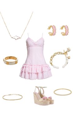 a pink dress and accessories are arranged on a white background