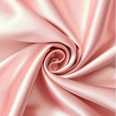 a close up view of pink satin fabric