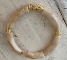 Such a gorgeous neutral bracelet with gold plated accents throughout. Caramel and cream swirls bangle bracelet on high quality stretch elastic. Neutral Bracelets, Clothespins Diy, Clothespin Diy Crafts, Beautiful Bracelet, Bangle Bracelets, Caramel, Gold Plate, Jewelry Bracelets, Bangles