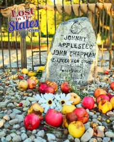 the grave of johnny appleseed and john chappman is surrounded by flowers and fruit