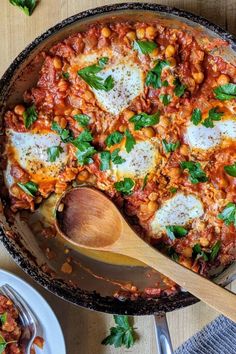 a skillet filled with baked beans and cheese