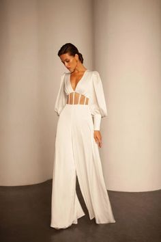 Satin bridal jumpsuit Modern wide leg bridal jumpsuit Palazzo pants wedding jumpsuit Minimalist V neck long sleeve bridal jumpsuit GAIA Name: Gaia Details: bridal jumpsuit «Gaia» features a V neck top with a sheer mesh corset on the waist and boning, long puff sleeves. The bottom of this jumpsuit Boho Wedding Jumpsuit The Bride, Wide Leg Bridal Jumpsuit, Wedding Jumpsuit Lulus, Bridal Corset Jumpsuit, Modern Wedding Jumpsuit, Bridal Overall, Lesbian Bridal Outfit, Bridal Outfit Change, Bridal Separates Pants