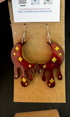 Custom made resin drippy moon earrings. One of a kind red and gold theme earrings with gold accents. Hand Painted Red Dangle Jewelry, Red Hand Painted Dangle Jewelry, Red Hand-painted Dangle Jewelry, Red Hand Painted Dangle Earrings, Red Hand-painted Dangle Earrings, Red Hand Painted Drop Earrings, Artistic Red Resin Jewelry, Handmade Red Dangle Plug Earrings, Artistic Red Drop Earrings