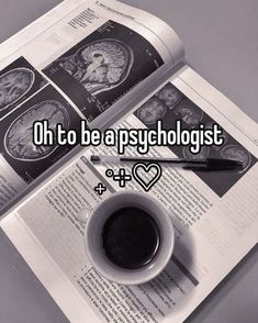 a cup of coffee sitting on top of an open book with the words oh to be a psychologist