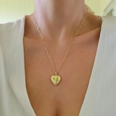 Heart locket necklace. Wear it on it's own or layer it. * we are not able to print your photo at the moment. you can cut out your own picture or order it online from site like postsnapPendant details: * Material: non tarnish gold filled* Measurements: 1.1' H 0.75' WChain: 18K gold filledComes in our gift ready packaging: vegan leather pouch for safe jewelry storing and branded box Heart Shaped Locket Necklace With Heart Charm For Memorial, Heart-shaped Locket Necklace With Heart Charm For Memorials, Heart Charm Memorial Locket Necklace, Medallion Locket Necklace For Valentine's Day Memorial, Memorial Heart Charm Locket Necklace, Mother's Day Heart Locket Necklace With Round Pendant, Memorial Heart Locket Necklace For Mother's Day, Mother's Day Heart Locket Necklace, Valentine's Day Memorial Medallion Locket Necklace