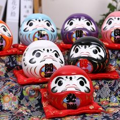 several colorfully painted eggs sitting on top of a table