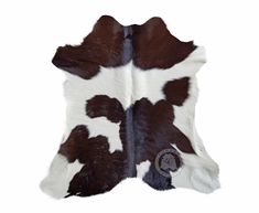 a cowhide rug with brown and white spots