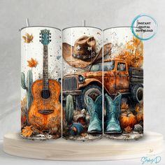 two candles with cowboy hats and boots on them next to an orange truck filled with pumpkins