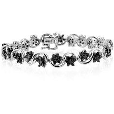 This absolutely stunning four ct. t.w. genuine black diamond bracelet in sterling silver is the perfect finishing touch for a romantic evening look. Turn heads as you saunter down the street while the jaw-dropping, genuine black diamonds bring out a dazzling shine, adding just the right amount of bling. This lovely bracelet will sparkle endlessly in the moonlight, showcasing each gorgeous diamond. Be ready to add undeniable glamour to your evening look with this basic yet brilliant wrist piece.B Elegant Black Diamond Round Bracelets, Elegant Black Diamond Round Bracelet, Elegant Bracelet With Black Diamonds, Elegant Black Tennis Bracelet For Anniversary, Elegant Black Bracelets For Anniversary, Classic White Gold Diamond Bracelet With Black Diamonds, Elegant Black Diamond Tennis Bracelet For Formal Occasions, Black Diamond Round Bracelet, Elegant Tennis Bracelet With Black Diamonds For Formal Occasions