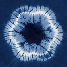 a blue and white tie dye photo taken from above