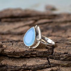 Natural Blue Chalcedony Gemstone Ring, Birthstone Ring, Chalcedony Ring, Designer Blue Ring, Artisan Ring, 925 Sterling Silver Ring Jewelry- Native-04 Size/Dimension (Approx) : All Sizes Available Gemstone : Blue Aqua Chalcedony Stone Shape : Pear Stone Size (Approx) : 14 x 10 mm Stone Color : Blue Aqua Please Note - Because you use natural good quality hand-selected gemstones Therefore, Colors and Inclusions of the Stone may Vary. I will Choose a Gorgeous Stone for You. Please Convo Us For Gems Blue Sterling Silver Teardrop Ring, Blue Teardrop Sterling Silver Ring, Sterling Silver Teardrop Blue Ring, Peach Morganite Ring, Peach Morganite, Jasper Ring, Chalcedony Stone, Chalcedony Ring, Blue Ring