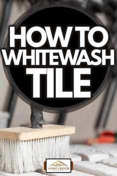 a white brush sitting on top of a wooden block with the words how to whitewash tile