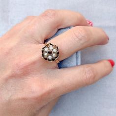 Featuring a classic floral design, this 9ct gold ring was inspired by the jewels of the Edwardian era and dates from 1965.  Condition Report: Good - Some flaking to the surface of the seed pearls. However, this is only visible upon very close inspection with a magnifying glass. This does not detract from the appeal of the piece.  The Details... This ring is created from 9ct gold. It is stamped 9.375 and features the Anchor mark to show it was made in Birmingham. It is stamped with the number 2 t Vintage Gold Rings, Edwardian Era, Seed Pearl, Jewelry Manufacturers, Birmingham, Floral Motif, Vintage Gold, Jewelry Care, Rings Statement