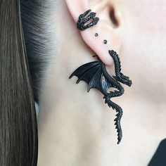 Exude an air of mystical charm with our Dragon Ear Jacket Earrings. The unique design, inspired by gothic aesthetics, makes for a bold statement. Expertly crafted to elevate your style game. Sold as Pair Material: 316 Stainless steel Regular post 21 Gauge Total height: 58mm Total width: 42mm Listing for pair of earrings only *RETURNS / REFUNDS * -If you would like to return you purchase , please contact us within 7 days of receiving your package and we will accept the return.Return will only be Steel Dragon, Earrings Gothic, Jewelry Ear, Edgy Jewelry, Front Back Earrings, Dragon Earrings, Ear Jacket Earring, 2 Earrings, Magical Jewelry