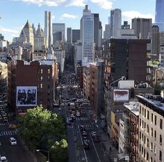 an aerial view of the city with tall buildings and billboards on it's sides