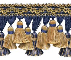 an image of tassels hanging from the side of a curtain with gold and blue trim