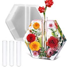 three vases with flowers in them next to each other