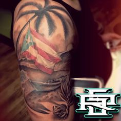 a man with a tattoo on his arm and an american flag in the palm tree