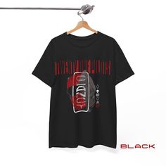 Rock Out in Style with Twenty One Pilots T-Shirts! |-/ Attention all Twenty One Pilots fans! Elevate your wardrobe with our exclusive T-shirts featuring unique designs inspired from Clancy. Perfect for any occasion, from concerts to casual hangouts, these tees will keep you comfortable and stylish while showing off your love for TOP. Available in sizes S - 5XL and a variety of colors to match your vibe. 𓃮 About the Product: - Made with Gildan Heavy Cotton 5000, ensuring a durable and comfortabl Edgy Graphic Design Short Sleeve T-shirt, Edgy Short Sleeve T-shirt With Graphic Design, Edgy Short Sleeve Graphic T-shirt, Edgy Fan Merchandise T-shirt With Logo Print, Edgy T-shirt For Fan Merchandise With Logo Print, Edgy T-shirt With Logo Print For Fan Merchandise, Edgy Short Sleeve T-shirt With Front Print, Edgy Short Sleeve Shirt With Graphic Design, Edgy Fan Merchandise T-shirt With Short Sleeves