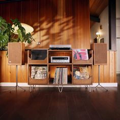 an entertainment center with stereo, record player and speakers