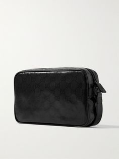 Gucci's messenger bag has been crafted in Italy from high-shine coated-canvas that's lightweight, durable and easy to clean. It's detailed with the house's iconic 'GG' monogram and perfectly sized to fit your phone, wallet and sunglasses. Black Shoulder Bag In Signature Coated Canvas For Travel, Black Signature Coated Canvas Shoulder Bag For Travel, Modern Business Bags In Signature Coated Canvas, Designer Shoulder Bag With Embossed Logo For Travel, Gucci Signature Coated Canvas Travel Shoulder Bag, Modern Black Gucci Bags, Black Travel Bags With Logo-jacquard Lining, Everyday Rectangular Shoulder Bag With Logo-jacquard Lining, Gucci Shoulder Bag In Signature Coated Canvas