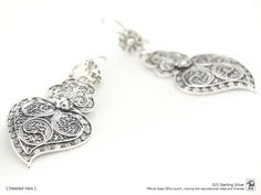 "Original Portuguese Filigree Heart Earrings, Fashion Folk - Traditional Filigree Jewelry from Viana, Portugal - Brand-new (Unused). Very elegant and exclusive earrings, handmade by experienced Artisans and manufactured in 925 Sterling Silver. Item specifics: Model: Heart EARRINGS Reference: JM-BR706 Backing type: hook Material: 925 Sterling Silver Height: aprox. 5.5 cm (with hook) Weight: aprox. 5 grams Condition: Brand-new (Unused) Original Portuguese Traditional Filigree Jewelry - Handcrafted Traditional Nickel-free Heart Earrings As Gift, Traditional Nickel-free Heart Earrings For Gift, Traditional Heart Earrings As Gift, Traditional Gift Heart Earrings Pierced, Traditional Heart Earrings For Pierced Ears As Gift, Traditional Heart-shaped Sterling Silver Jewelry, Traditional Pierced Heart Earrings, Elegant Handmade Sterling Silver Heart Earrings, Traditional Heart-shaped Earrings