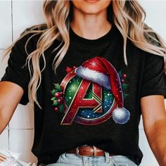 DESCRIPTION: Avengers Christmas shirt Design and Customization Details: This design is created using DTG (Direct to Garment) printing. If you would like to add or modify any aspect of the design shown in the display image, please contact the seller through the message box to confirm if the changes can be accommodated. If you place the order without prior confirmation, the item will be sent as shown, without any modifications. Refer to the color charts for the size and type of T-shirt you desire. Christmas Festive Shirt With Graphic Print, Festive Christmas Graphic Print Shirt, Christmas Holiday Shirt With Graphic Print, Christmas Holiday Graphic Print Shirt, Avengers Christmas, Avengers Shirt, Types Of T Shirts, Christmas Custom, Message Box