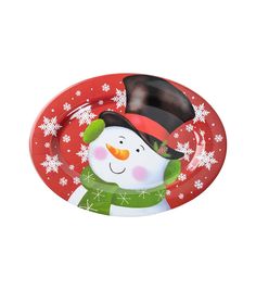 a red plate with a snowman design on the front and bottom, holding a black hat