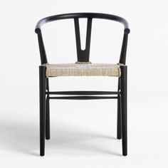 a black wooden chair with a woven seat