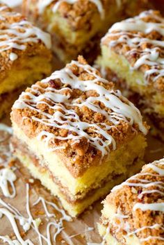 several pieces of cake with white icing on top