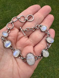 🤍 For The Love Of Moonstones! 🤍  Here we have the most glorious sterling silver 925 and rainbow moonstone vintage style bracelet. I think it has been commissioned and would be a one of a kind handmade piece of jewellery. I would imagine it probably dates back to around the 1980's-1990's.  A lovely chunky linked chain full of iridescent rainbow moonstone crystals. It has a T-Bar clasp for fastening. It is a decent size to fit a medium sized wrist.  From end to end it is approx: TBC.  Hallmarked Spiritual Crystals, Moonstone Crystal, Bangles Jewelry, Moon Stone, Rainbow Moonstone, Vintage Stil, Sterling Silber, Link Bracelets, Fashion Bracelets