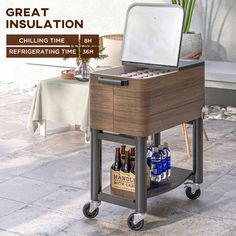 an open cooler sitting on top of a cart filled with bottles and cans next to a potted plant