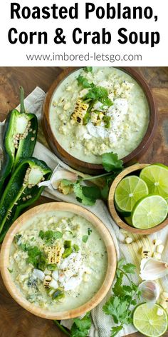 two bowls filled with corn and crab soup on top of a wooden table next to limes