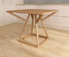 a wooden table sitting on top of a hard wood floor