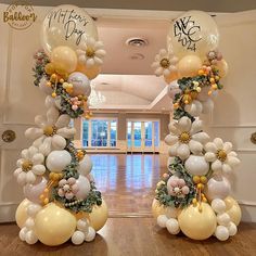 an entrance decorated with balloons and flowers