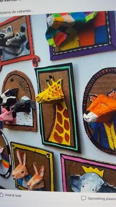 the wall is decorated with colorful paper cutouts and animal heads on it's sides