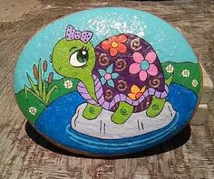 a painted rock with a turtle on it