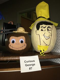 two pumpkins that have been carved to look like cartoon characters