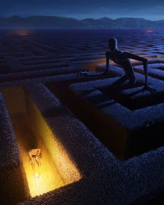 a person sitting in the middle of a maze with a light shining on it's face