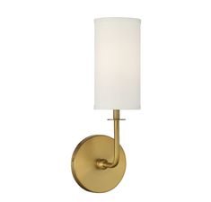 a wall light with a white shade on the side and a gold finish to it