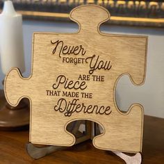 a wooden puzzle with the words never forget you are the piece that made the difference