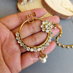 A pair of Beautiful Nose Ring – White Nose Pin with Chain for Wedding. Size & Other Details Diameter:  4cm Weight : 14gm Material  : Copper, Pearl, Kundan Attire :  Lehenga Choli, Saree Hoop Jewelry For Wedding And Festivals, Adjustable Hoop Jewelry For Wedding, Hoop Jewelry For Weddings And Festivals, Wedding Hoop Jewelry For Festivals, White Hoop Nose Rings For Wedding, Bollywood Style Gold Nose Rings For Wedding, Indian Nose Jewelry, Kundan Nose Ring, Indian Nose Ring Hoop Bridal