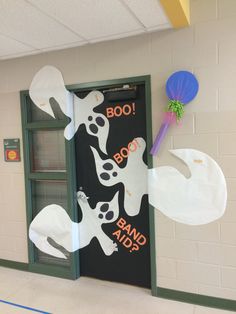 a door decorated to look like a ghost with the words boo boo and band aid on it