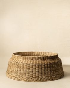 a large woven basket sitting on top of a table