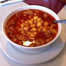 a white bowl filled with soup on top of a table