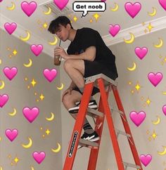 a man sitting on top of a red ladder next to a wall covered in hearts